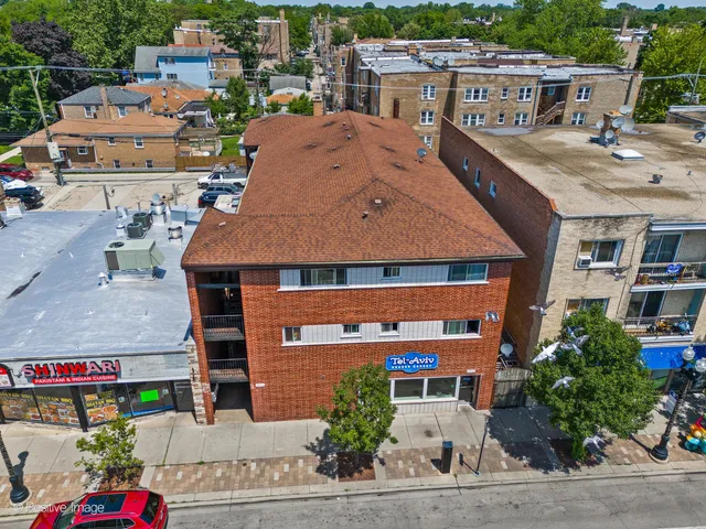 a aerial view of a house with a garden and plants