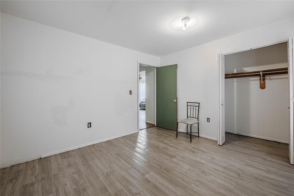 5 North Street Frostproof, FL 33843 - Photo 20 of 22 an empty room with wooden floor and windows
