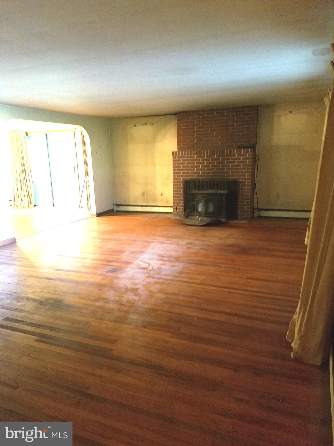 1546 North Stepney Road Aberdeen, MD 21001 - Photo 4 of 19 Living Room has fireplace with woodstove insert.