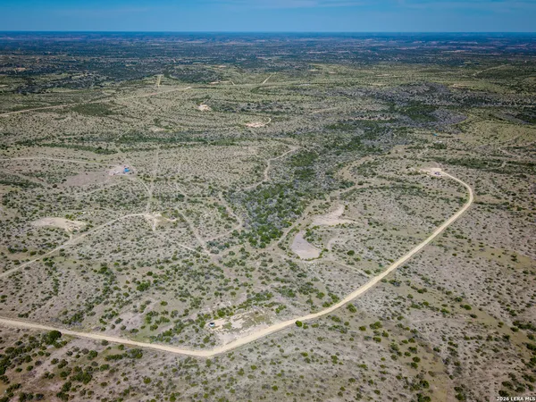 an aerial view of beach and yard