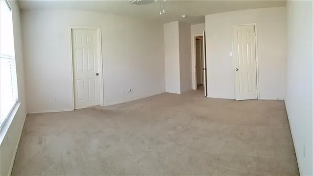 an empty room with closet area