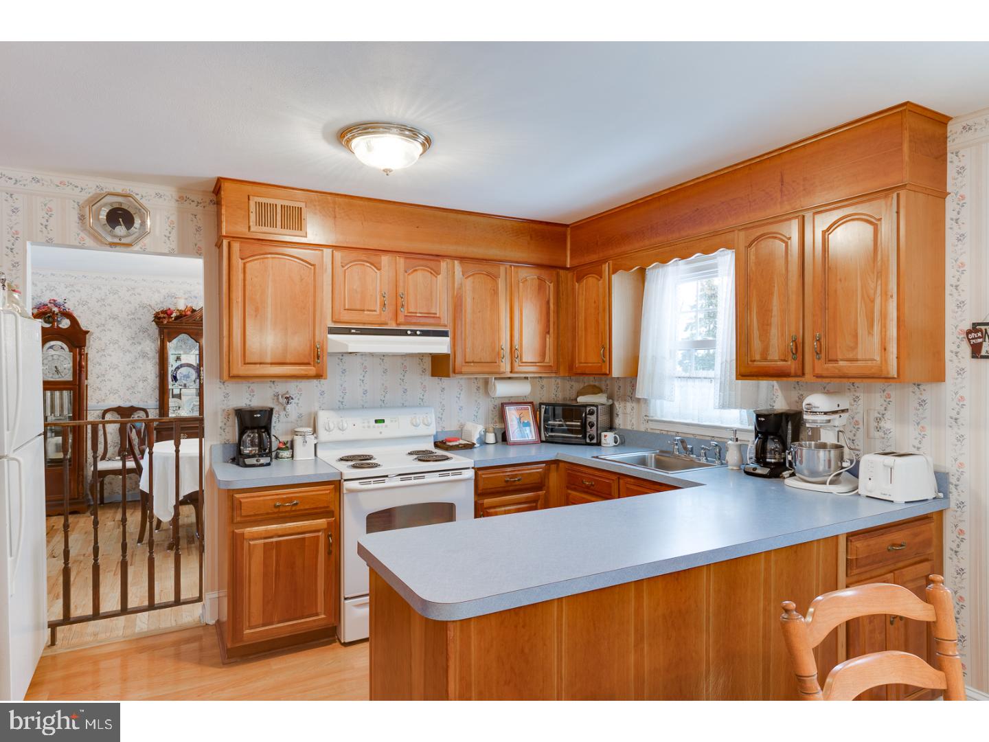 4 Manor Road Hamilton, NJ 08690 - Photo 13 of 25 a kitchen with stainless steel appliances granite countertop a sink stove and refrigerator