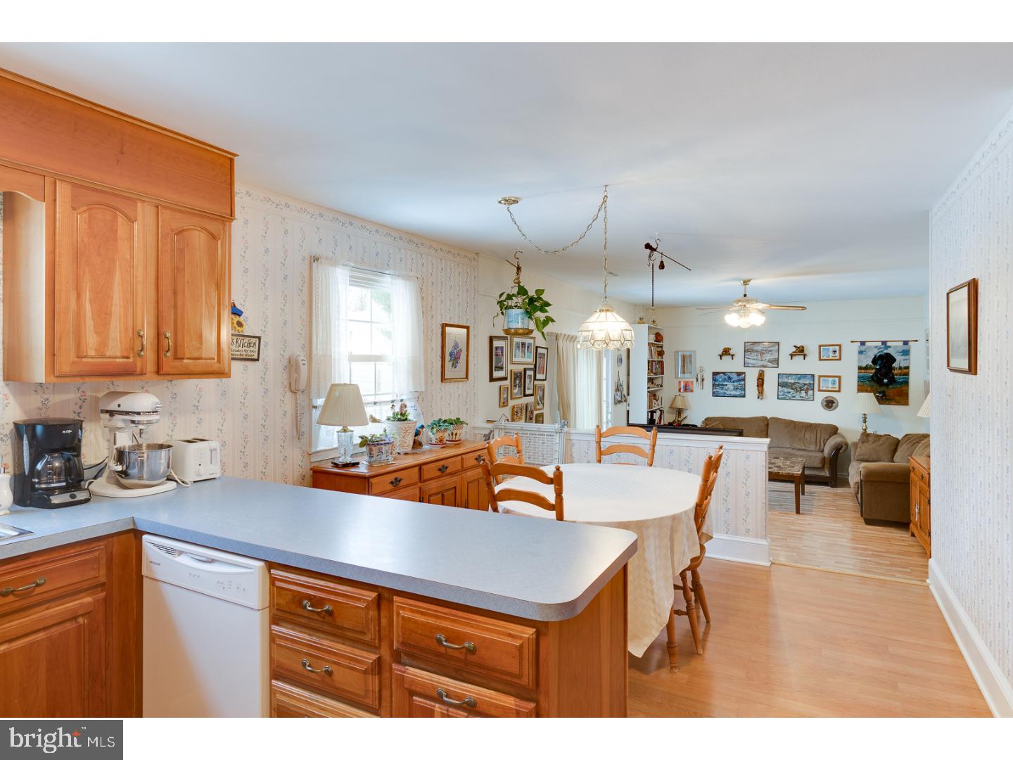 4 Manor Road Hamilton, NJ 08690 - Photo 14 of 25 a kitchen with a sink a stove and chairs