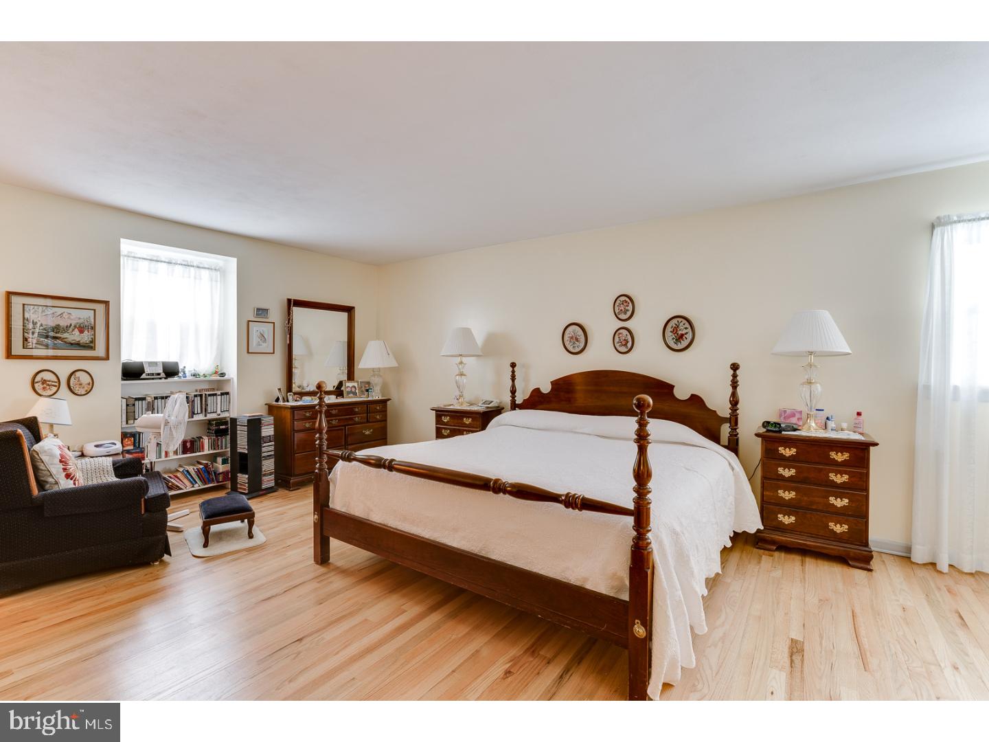 4 Manor Road Hamilton, NJ 08690 - Photo 15 of 25 a bedroom with a bed and wooden floor