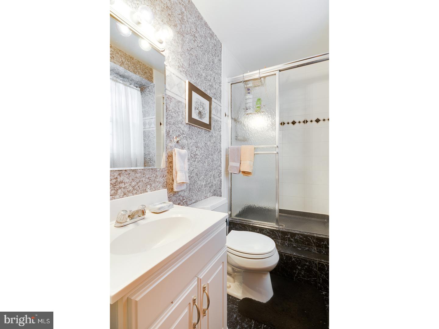 4 Manor Road Hamilton, NJ 08690 - Photo 18 of 25 a bathroom with a sink toilet and shower