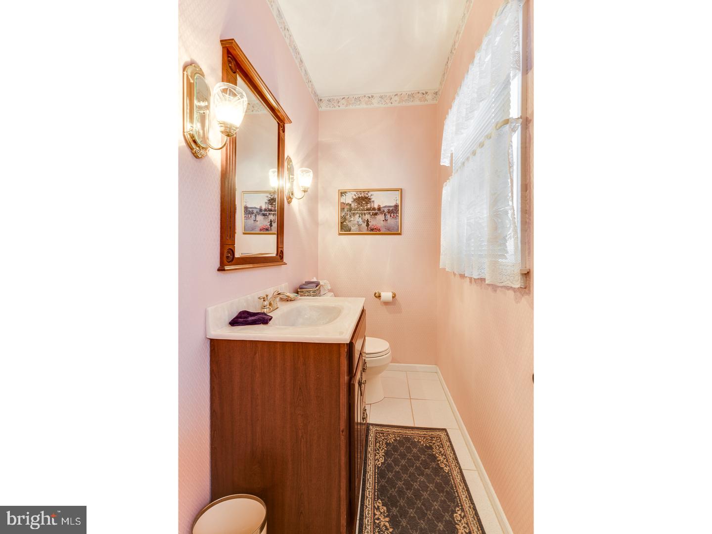 4 Manor Road Hamilton, NJ 08690 - Photo 2 of 25 a bathroom with a sink and a mirror