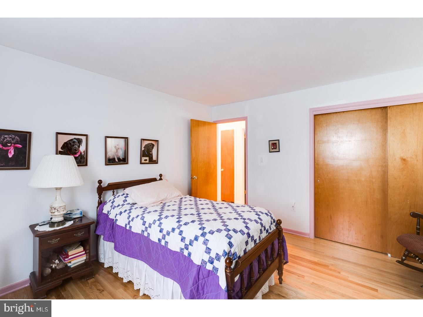 4 Manor Road Hamilton, NJ 08690 - Photo 23 of 25 a bedroom with a bed and wooden floor