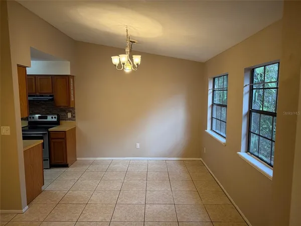 a view of a livingroom with a kitchen