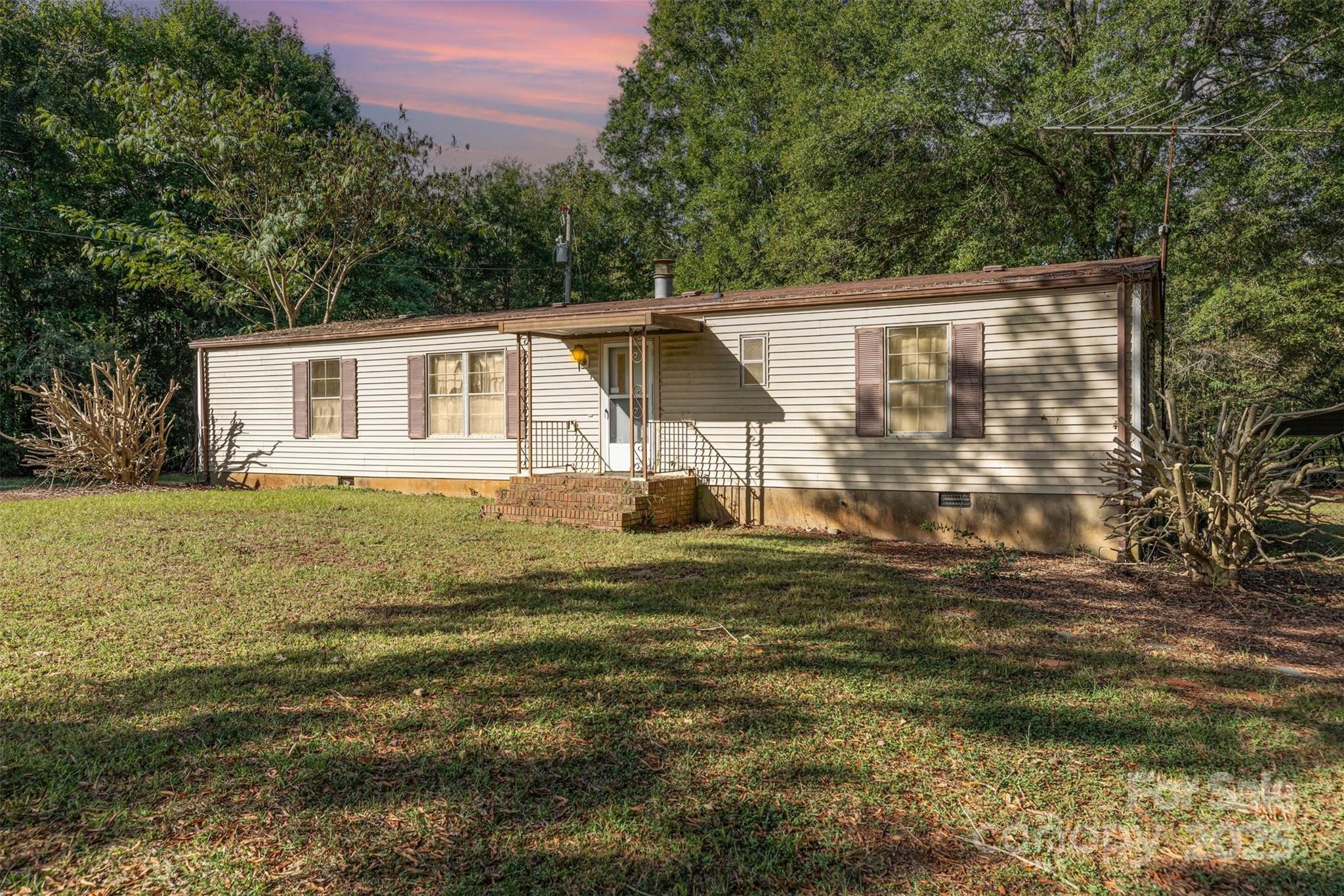 11500 Beagle Street Midland, NC 28107 - Photo 1 of 15 a front view of a house with garden