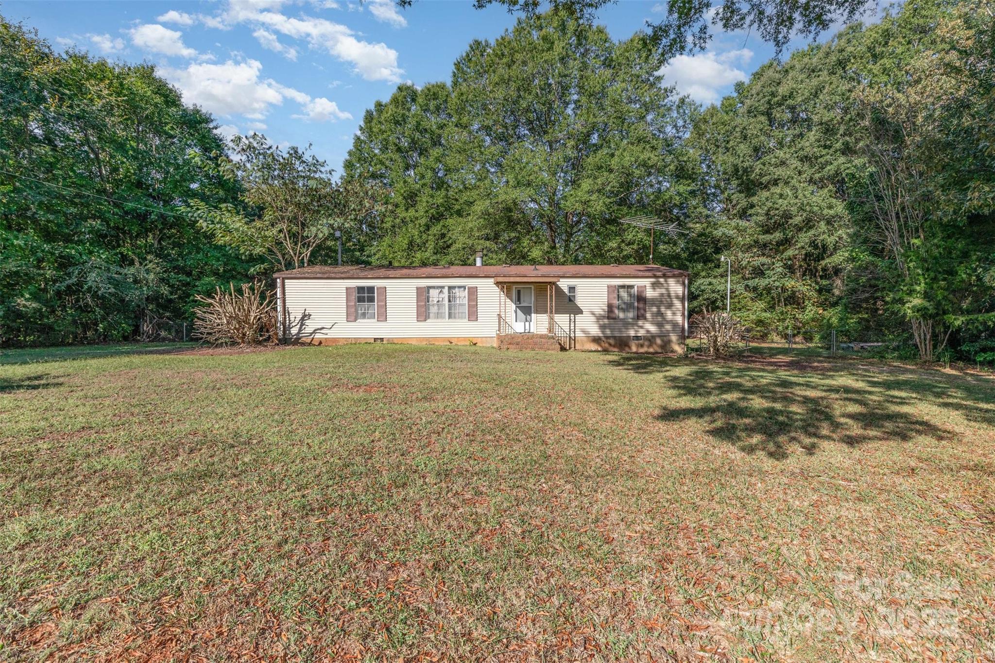 11500 Beagle Street Midland, NC 28107 - Photo 12 of 15 a view of a house with a yard
