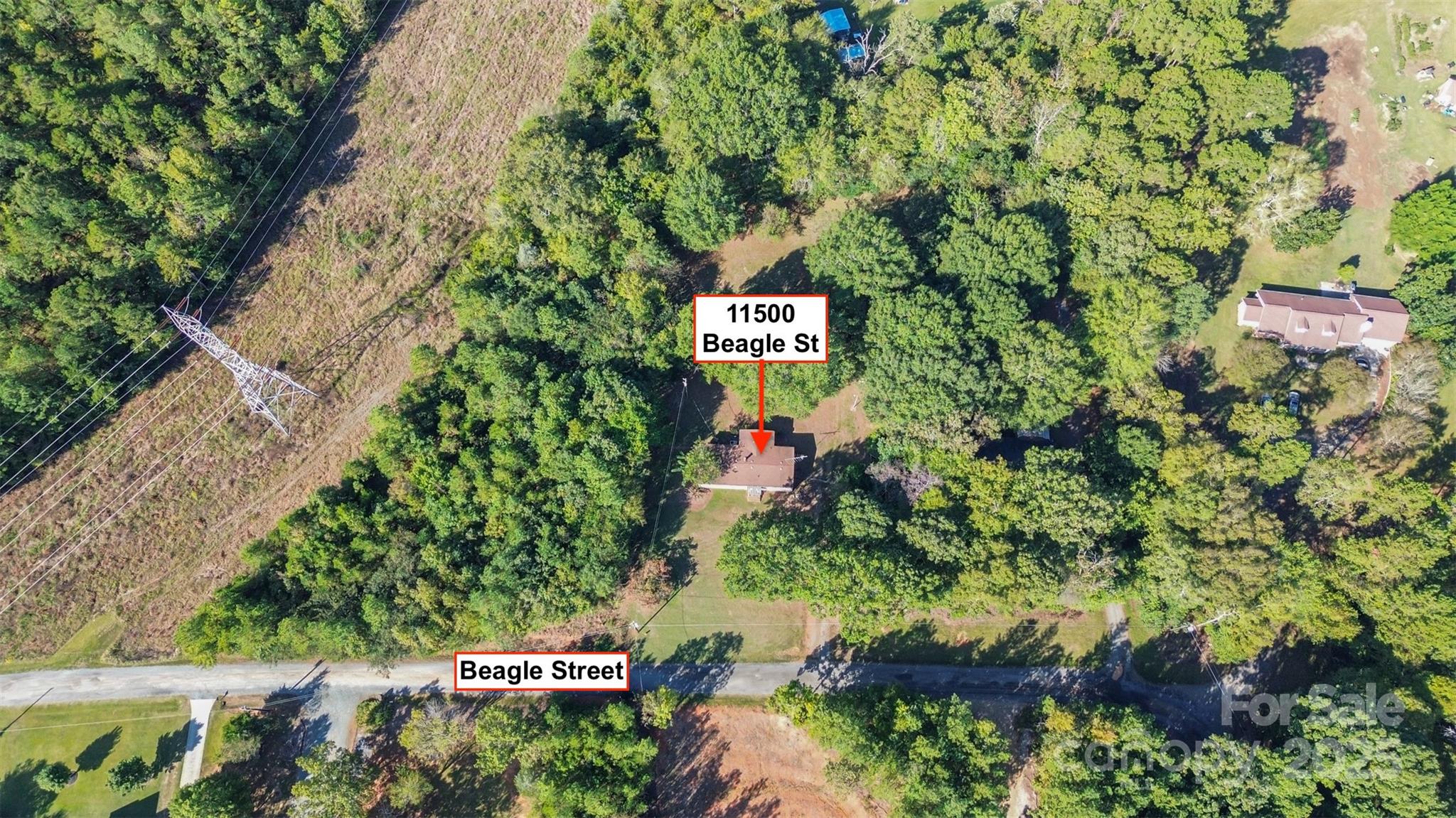 11500 Beagle Street Midland, NC 28107 - Photo 4 of 15 a sign that is sitting in a forest