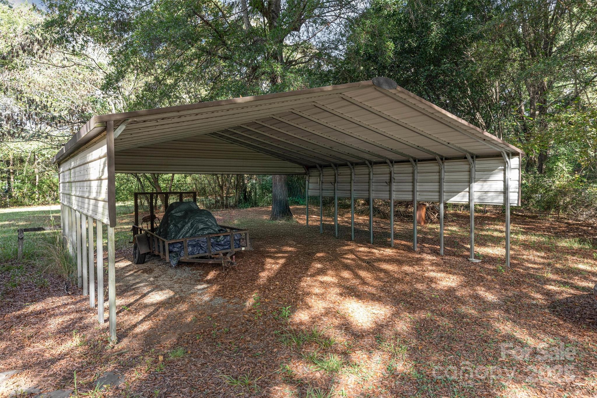 11500 Beagle Street Midland, NC 28107 - Photo 10 of 15 a backyard of a house with table and chairs
