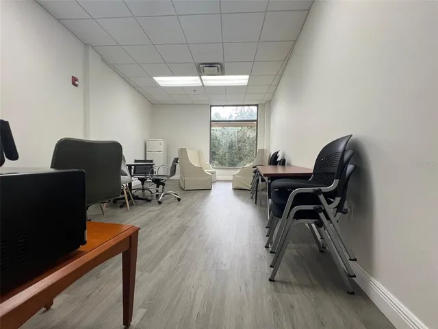 a workspace with furniture hardwood and a window