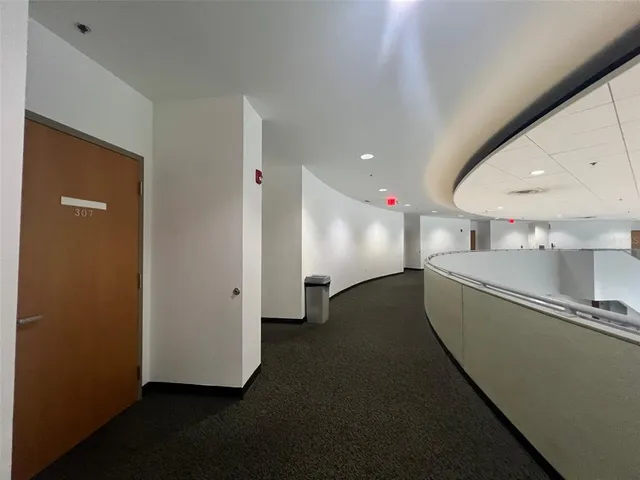 a view of a hallway with staircase