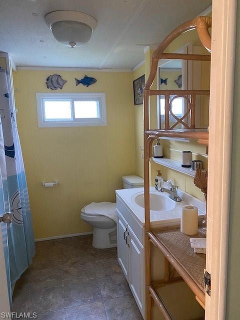 137 Rookery Road Naples, FL 34114 - Photo 11 of 23 a bathroom with a toilet and a sink