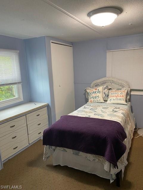 137 Rookery Road Naples, FL 34114 - Photo 12 of 23 a bedroom with a bed and a window