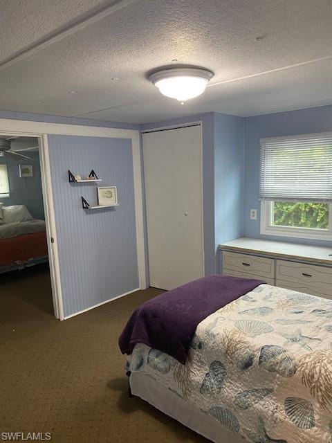 137 Rookery Road Naples, FL 34114 - Photo 13 of 23 a bedroom with a bed and a lamp