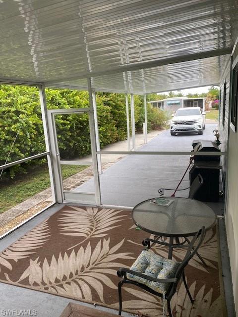 137 Rookery Road Naples, FL 34114 - Photo 18 of 23 a view of a dining room with furniture window and outside view