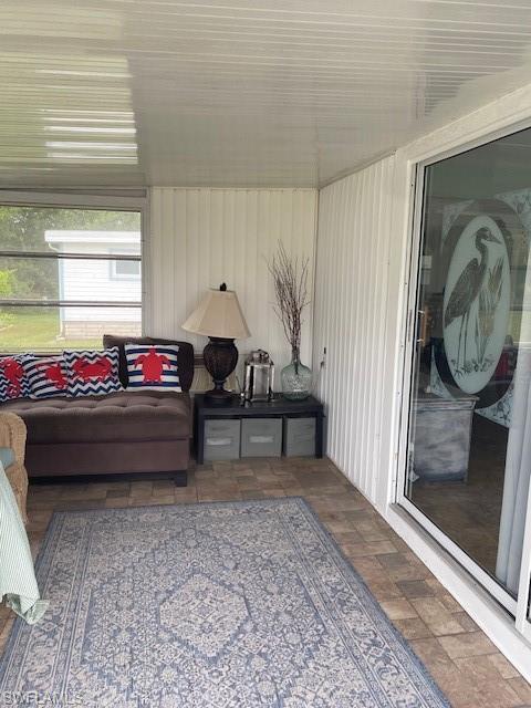 137 Rookery Road Naples, FL 34114 - Photo 2 of 23 a living room with a bed furniture and a window