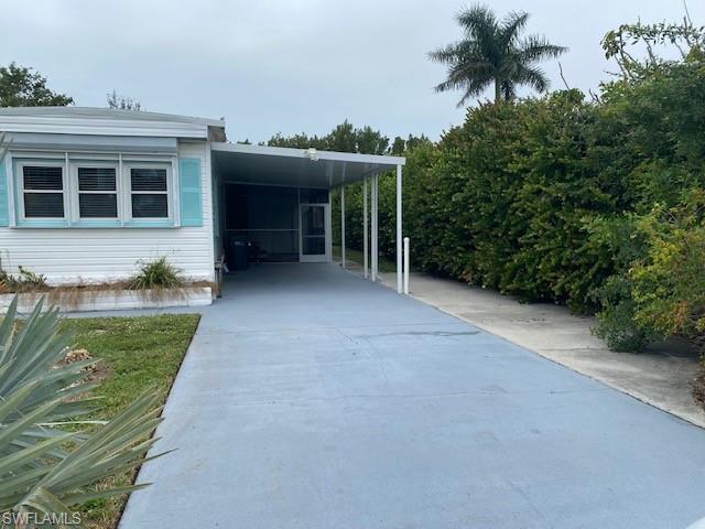 137 Rookery Road Naples, FL 34114 - Photo 23 of 23 a view of a house with a yard and potted plants