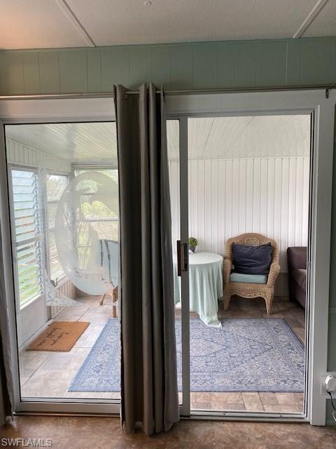 137 Rookery Road Naples, FL 34114 - Photo 5 of 23 a living room with furniture and a rug