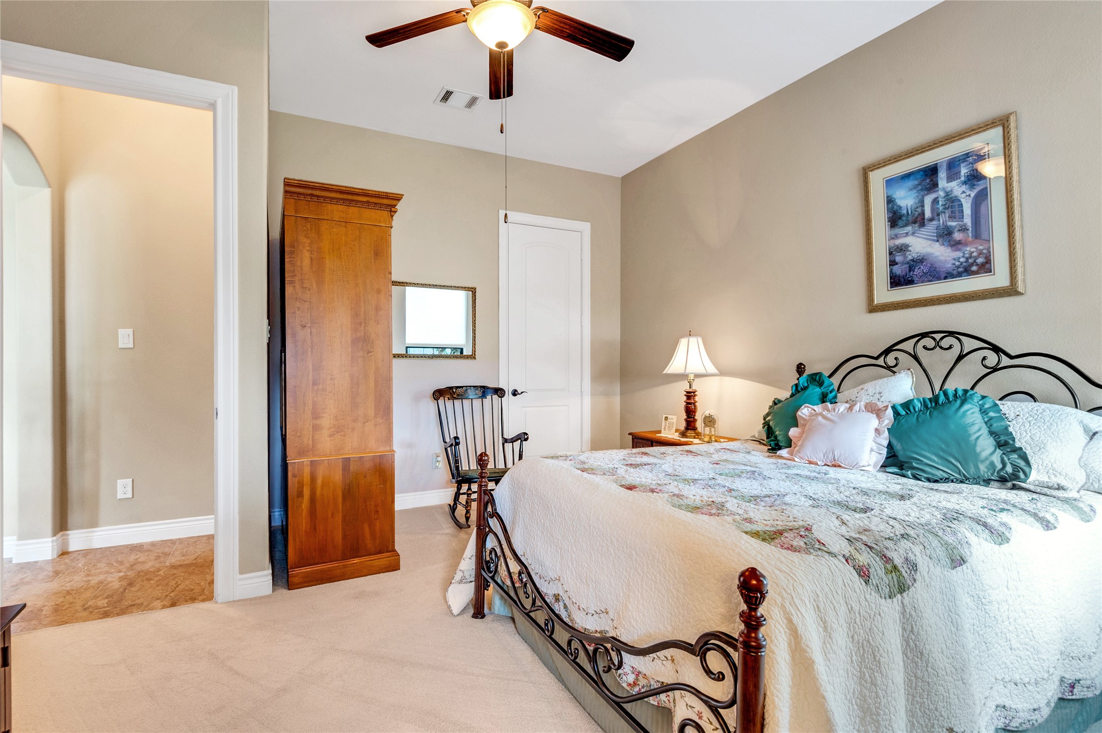 6119 Lofty Lane Spring, TX 77379 - Photo 31 of 40 This first floor guest bedroom features a ceiling fan, neutral walls, and carpet flooring. This guest bedroom has its own bathroom.