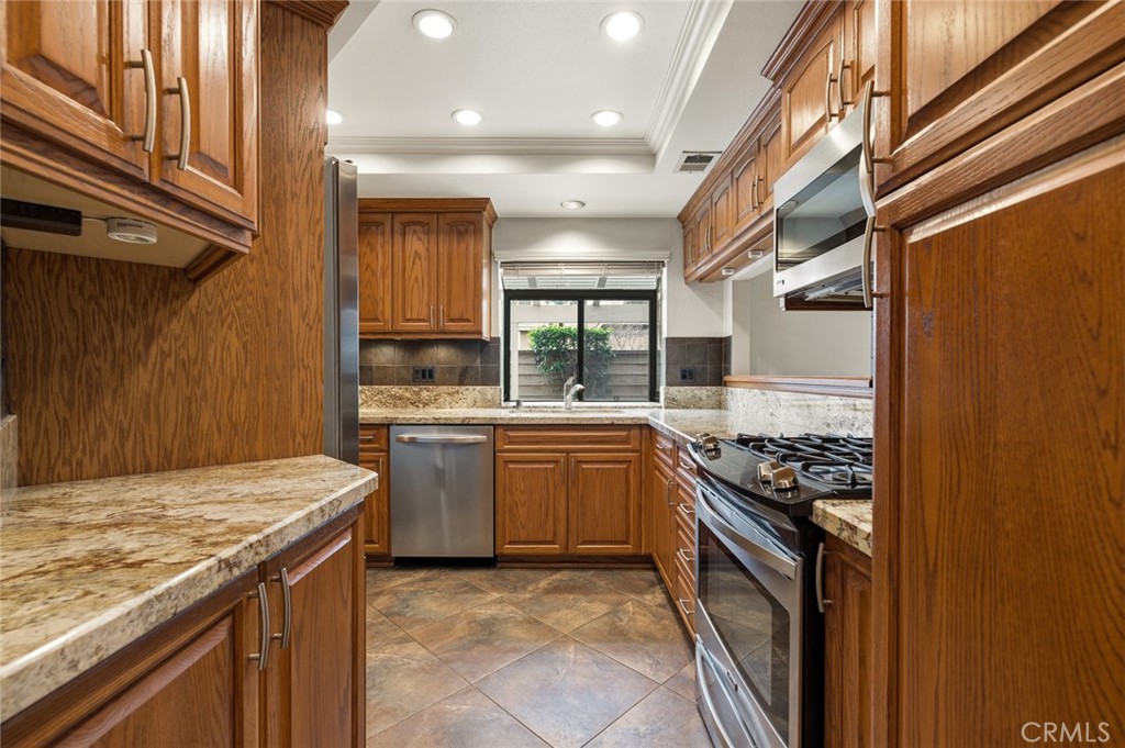 919 Auburn Road San Dimas, CA 91773 - Photo 15 of 52 Kitchen with stainless steel appliances, including refrigerator
