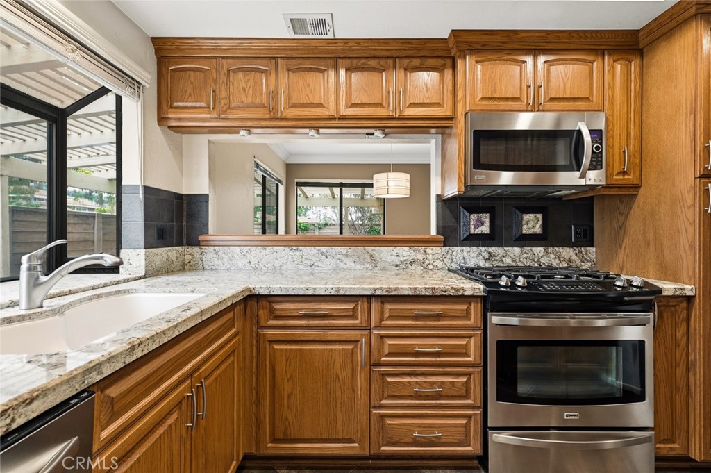 919 Auburn Road San Dimas, CA 91773 - Photo 16 of 52 Kitchen showing opening to dining room
