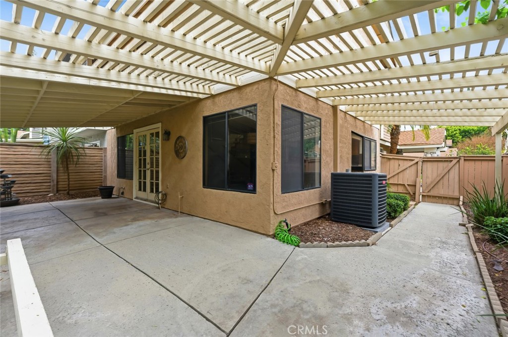 919 Auburn Road San Dimas, CA 91773 - Photo 39 of 52 Back Patio area showing A/C Unit and Side Gate