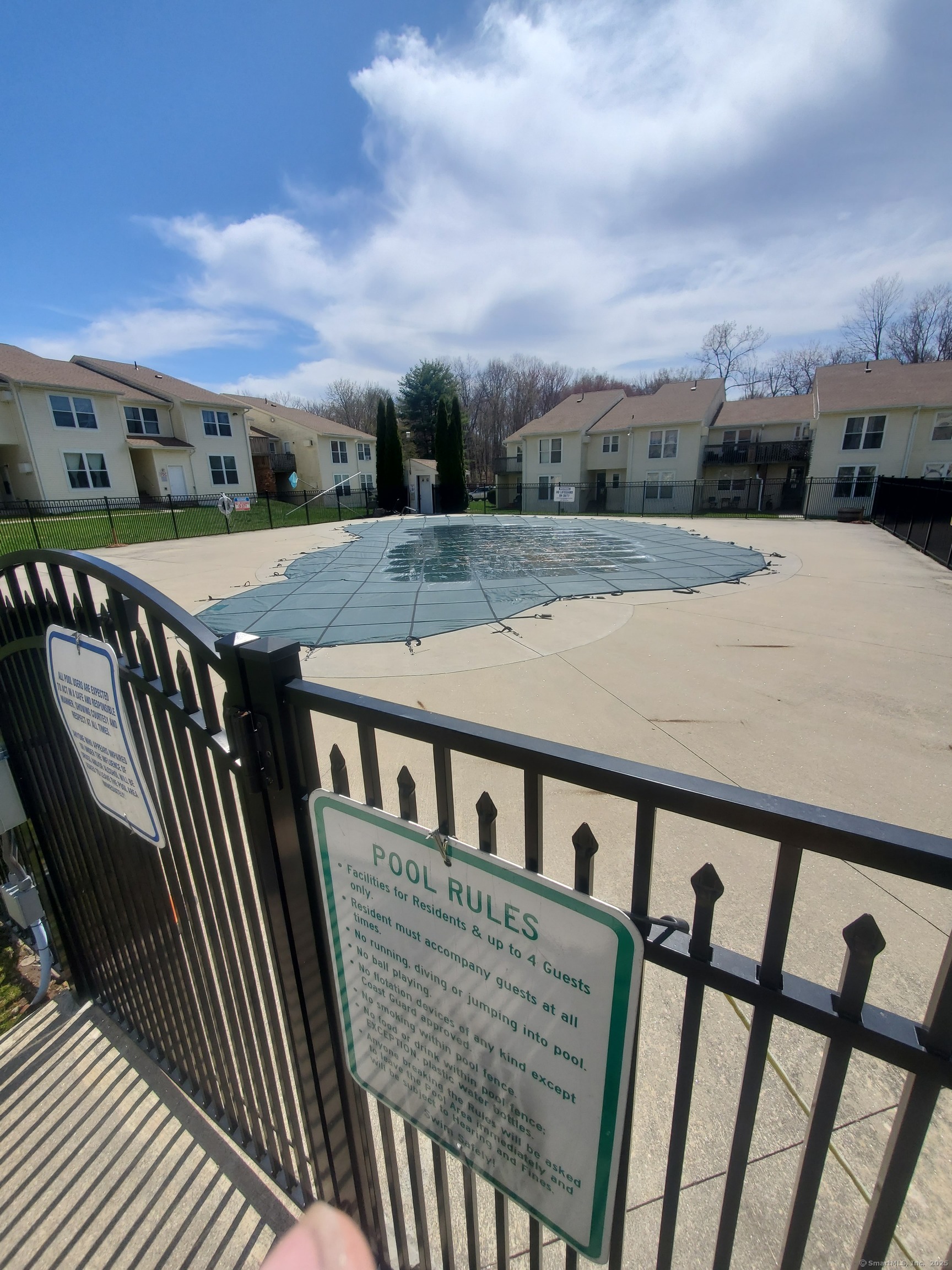949 Pleasant Valley Road, Unit 59 South Windsor, CT 06074 - Photo 6 of 8 a view of a balcony with wooden floor and city view