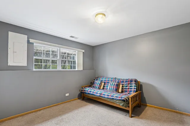 a bedroom with a bed and window