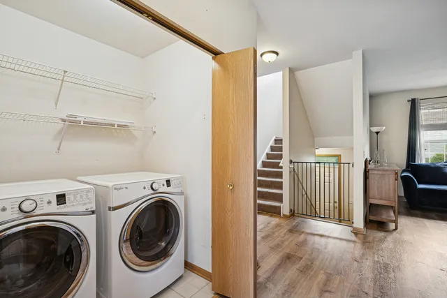 a view of a hallway with washer and dryer