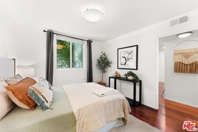 a bedroom with a bed and a table