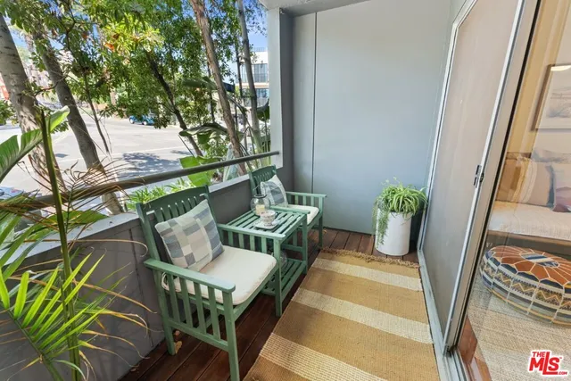 a view of an outdoor sitting area with furniture