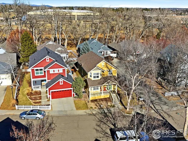 an aerial view of residential houses with outdoor space