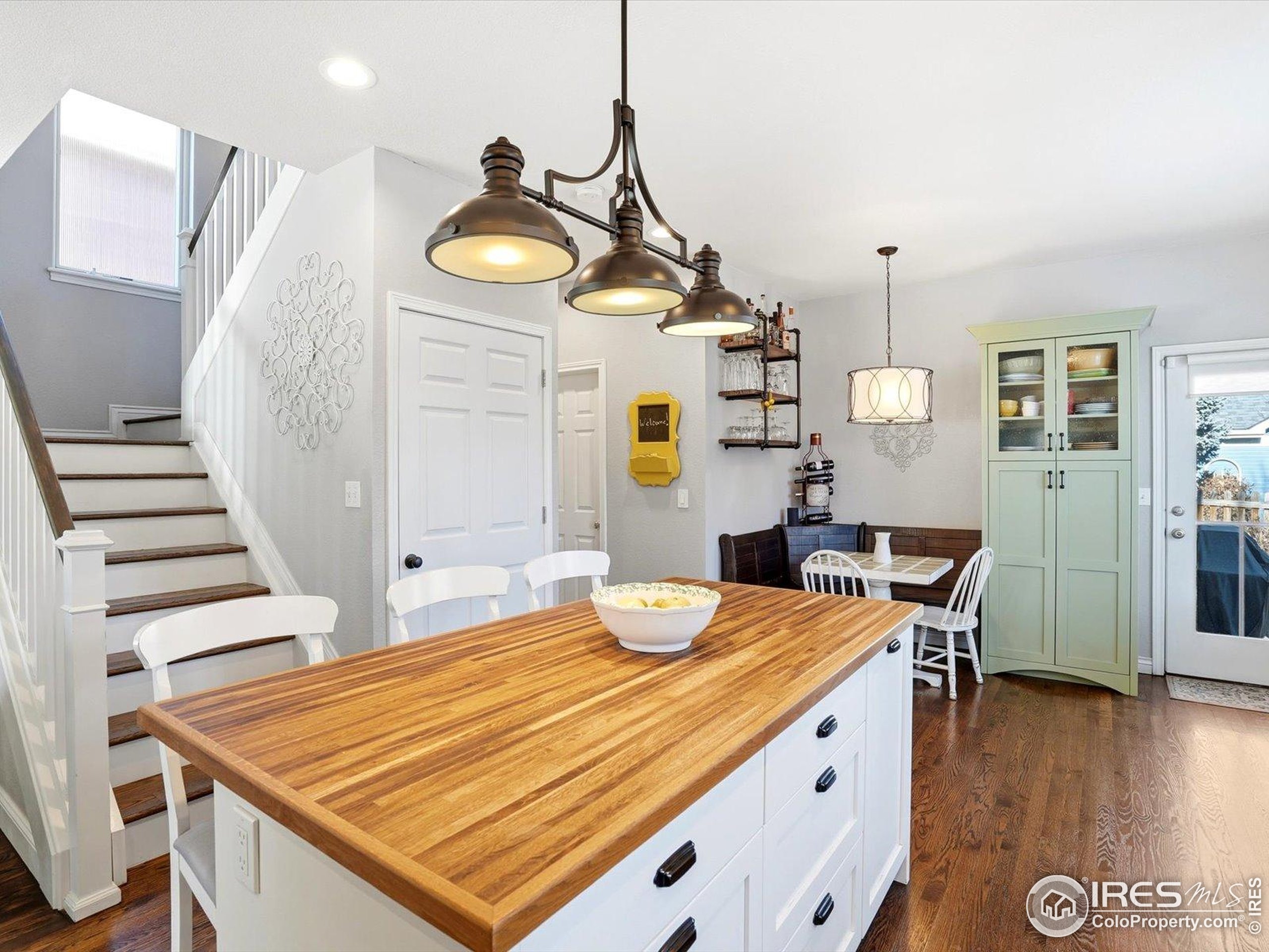 2139 Springs Place Longmont, CO 80504 - Photo 17 of 50 a bedroom with a bed and wooden floor