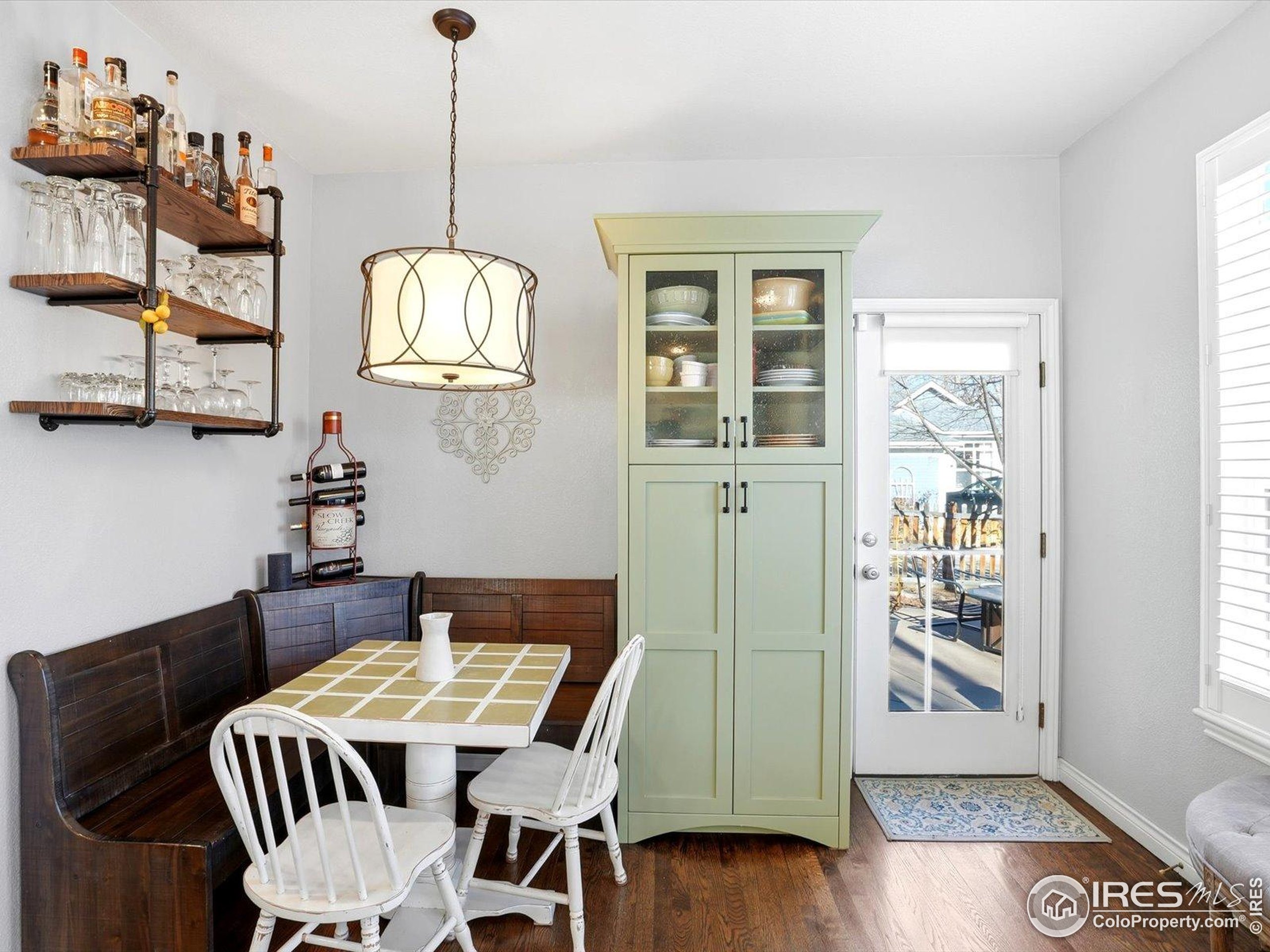 2139 Springs Place Longmont, CO 80504 - Photo 18 of 50 a view of a dining room with furniture window and wooden floor