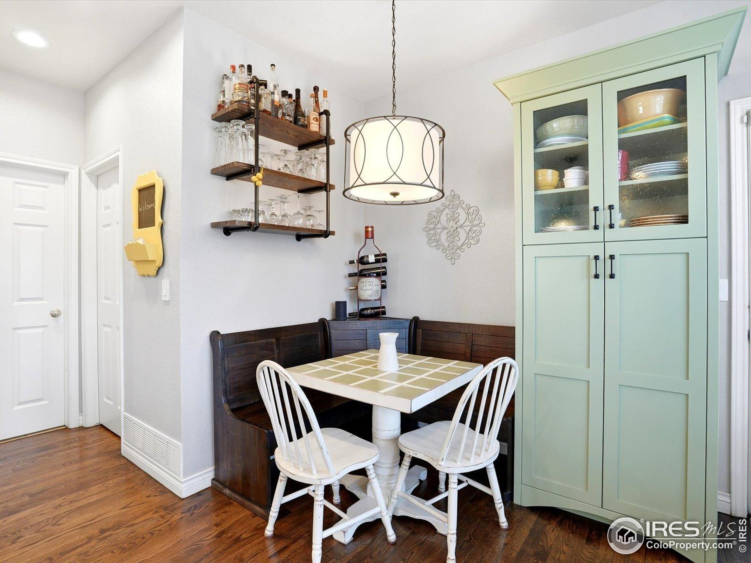 2139 Springs Place Longmont, CO 80504 - Photo 19 of 50 a view of a dining room with furniture and wooden floor