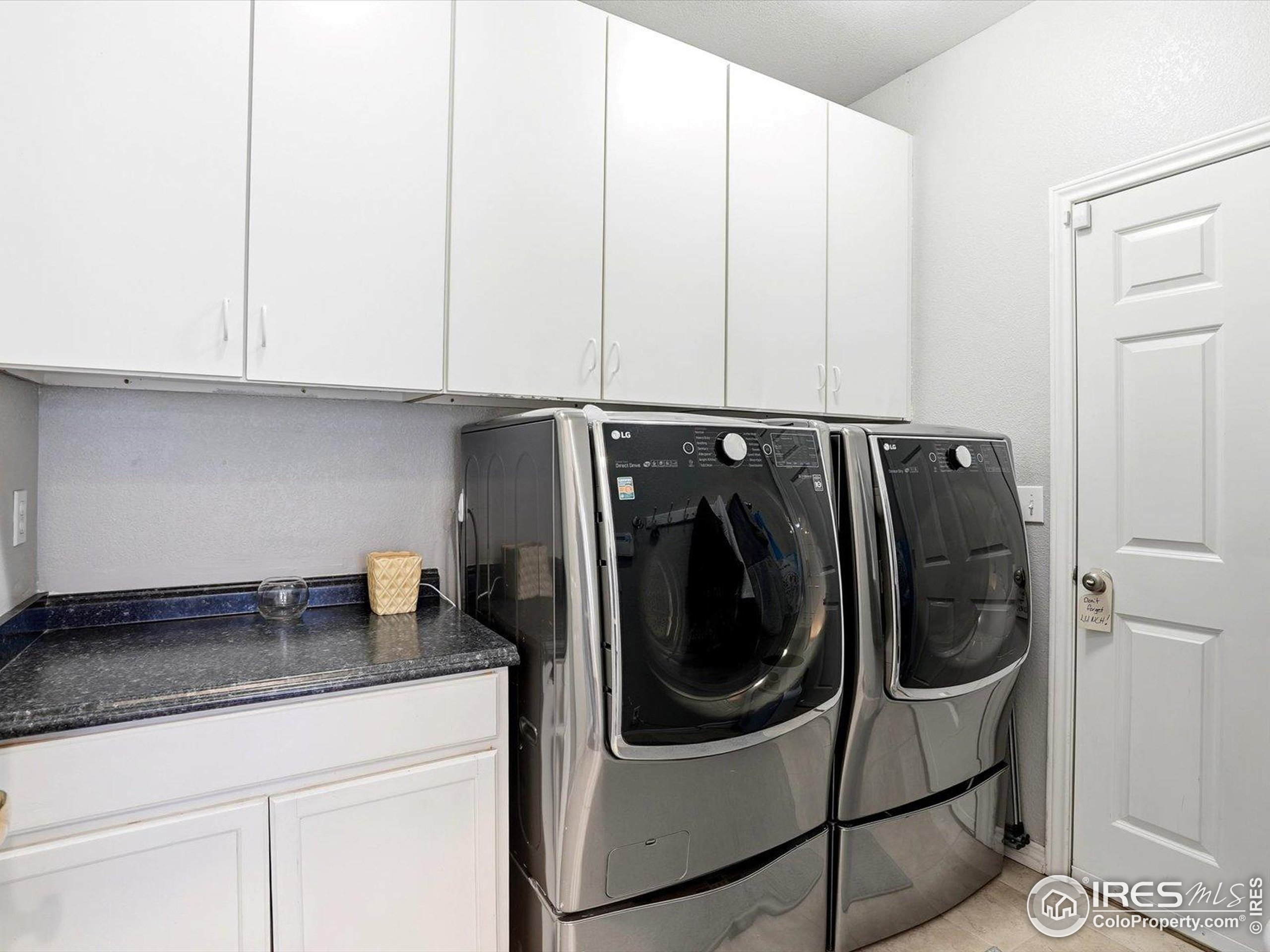 2139 Springs Place Longmont, CO 80504 - Photo 22 of 50 a utility room with washer and dryer