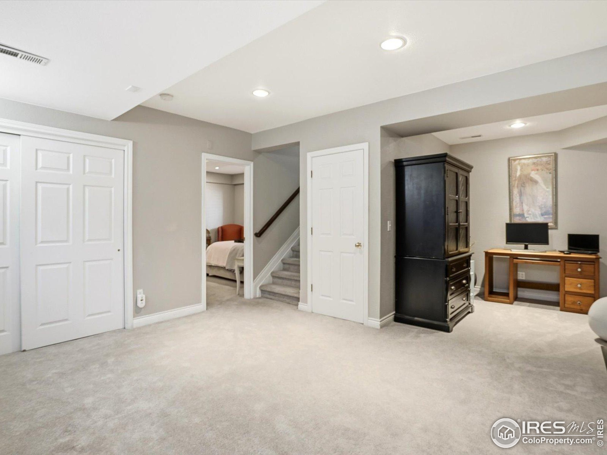 2139 Springs Place Longmont, CO 80504 - Photo 25 of 50 a view of a livingroom with furniture and a refrigerator