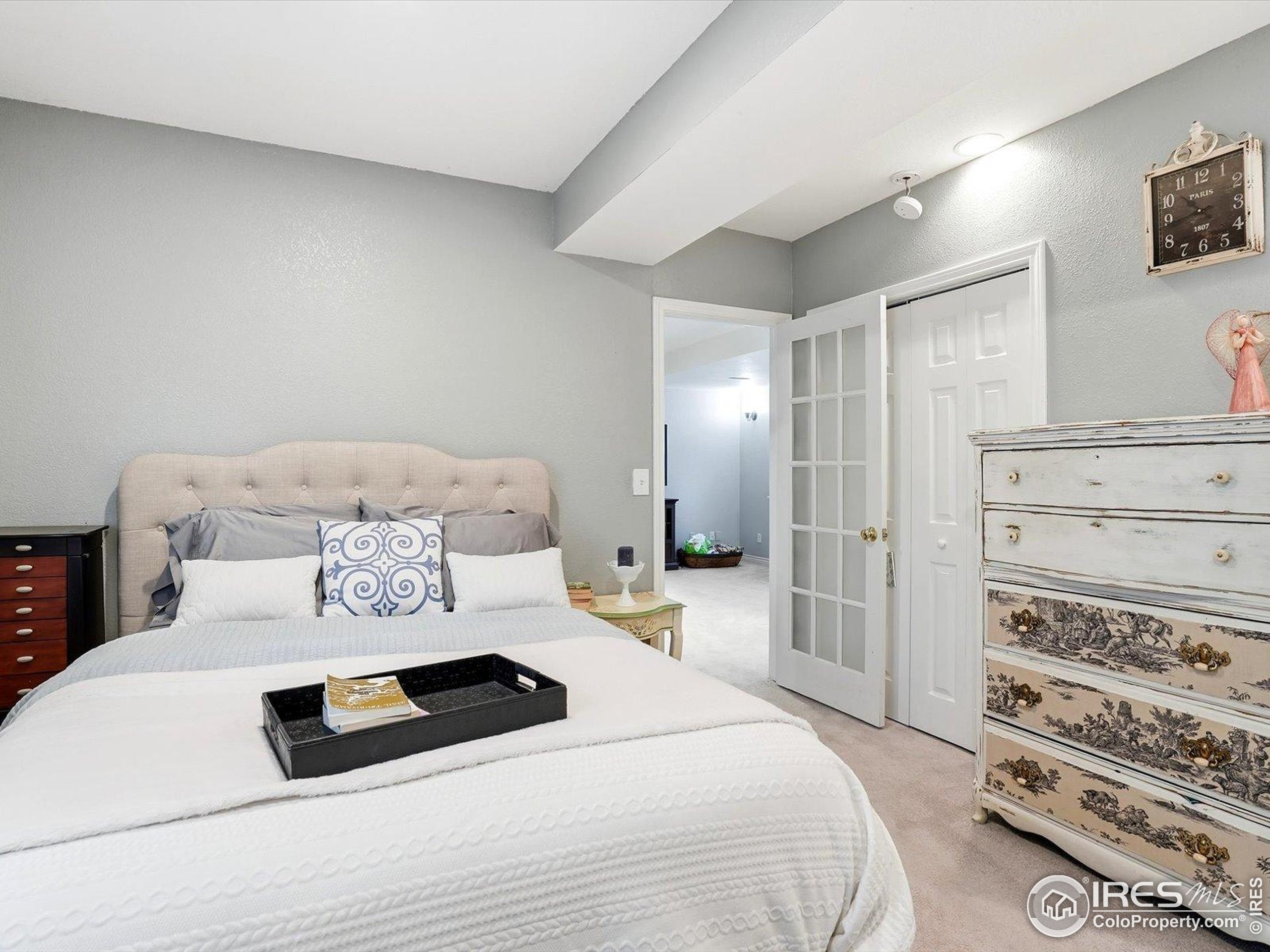 2139 Springs Place Longmont, CO 80504 - Photo 28 of 50 a bedroom with a bed and a mirror