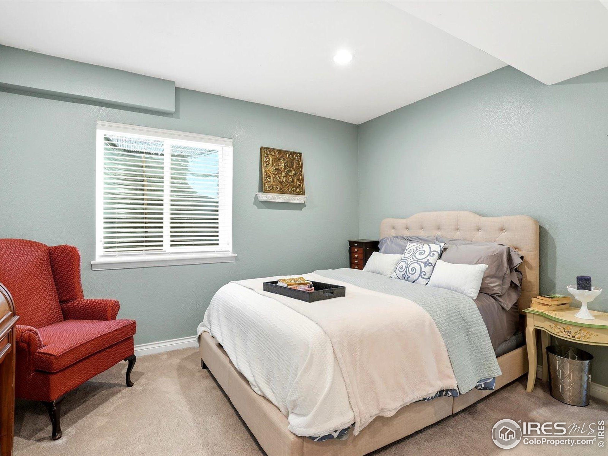 2139 Springs Place Longmont, CO 80504 - Photo 29 of 50 a bedroom with bed and a couch