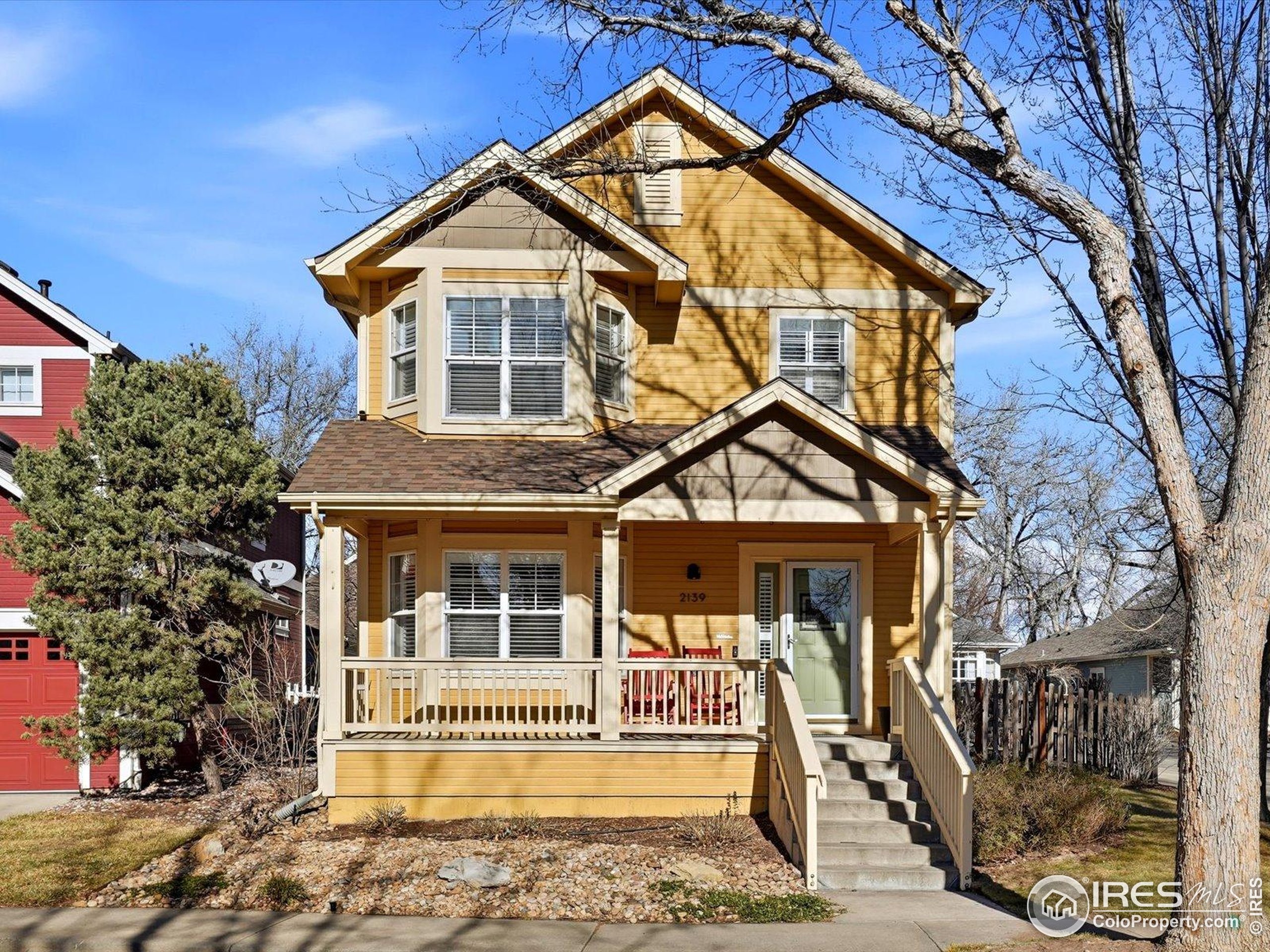 2139 Springs Place Longmont, CO 80504 - Photo 3 of 50 a front view of a house with a porch