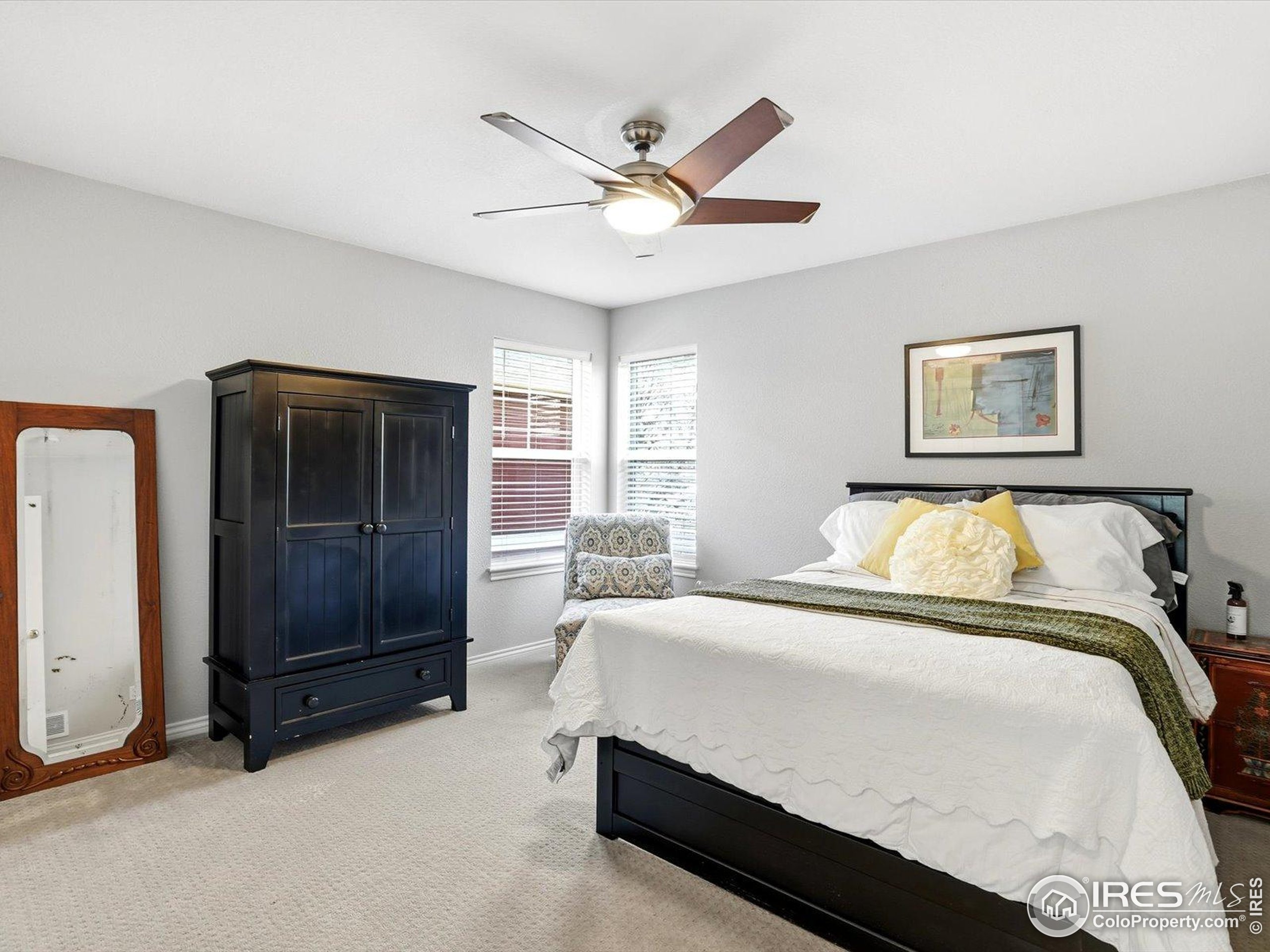 2139 Springs Place Longmont, CO 80504 - Photo 32 of 50 a bedroom with a bed and window