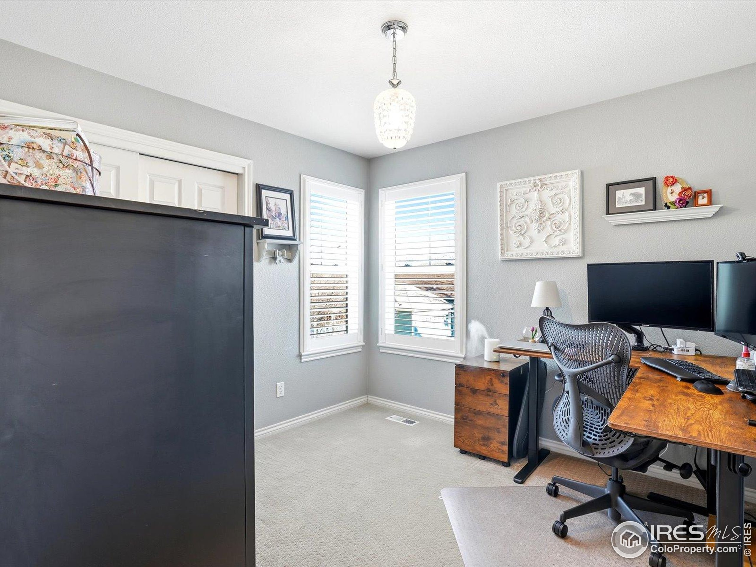2139 Springs Place Longmont, CO 80504 - Photo 34 of 50 a view of workspace with windows cabinet