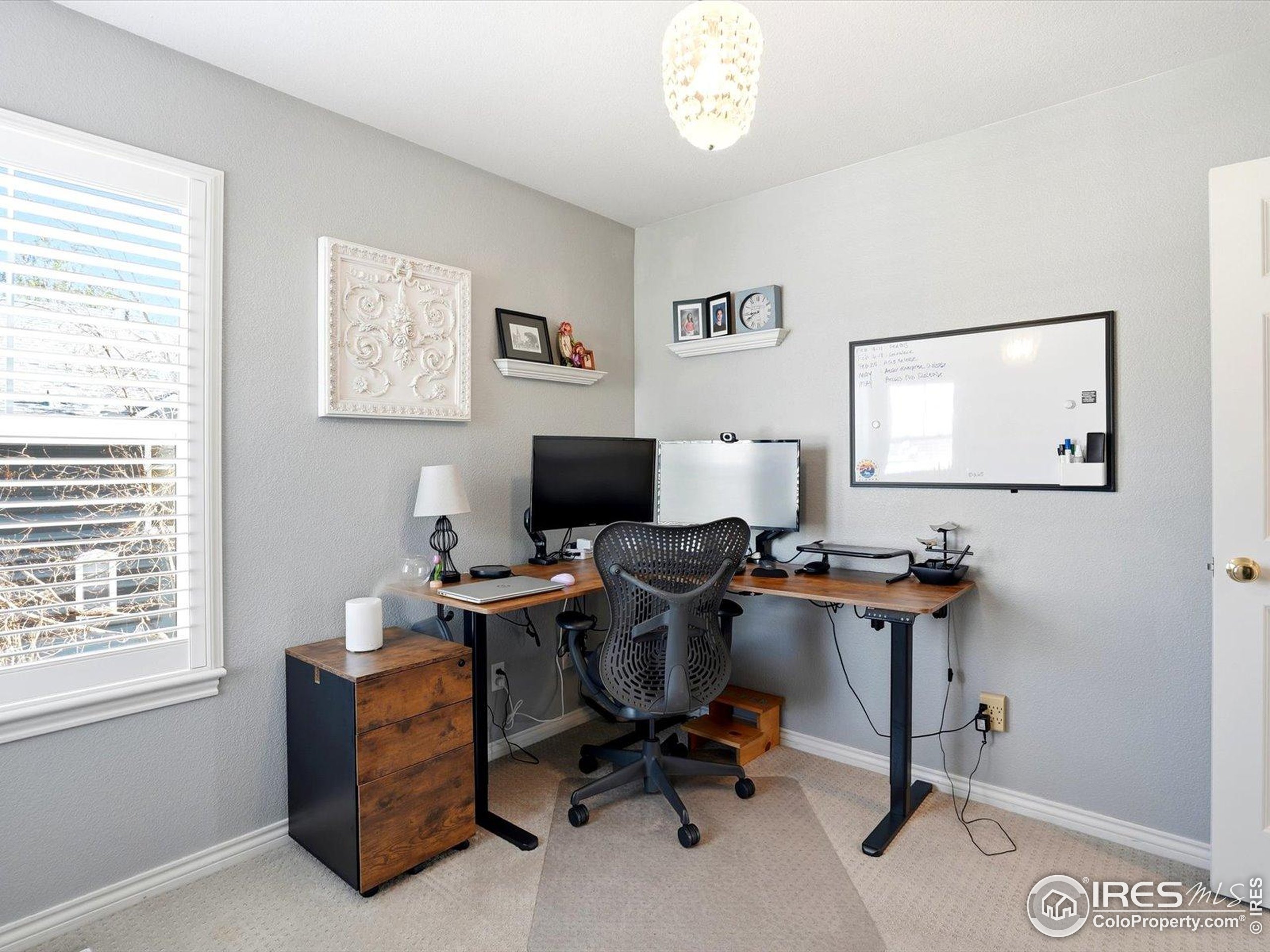 2139 Springs Place Longmont, CO 80504 - Photo 35 of 50 a view of a workspace with furniture and a window