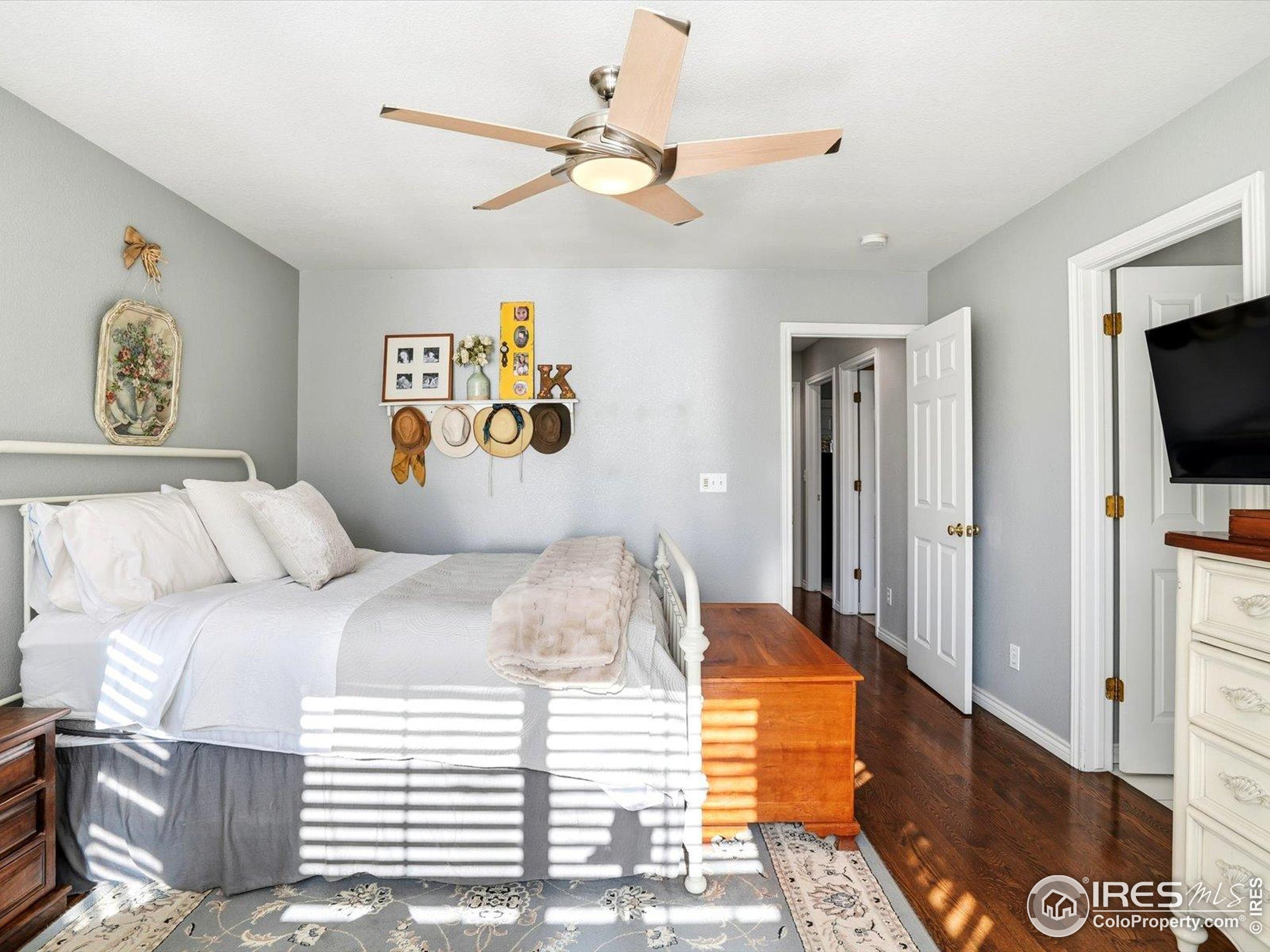 2139 Springs Place Longmont, CO 80504 - Photo 39 of 50 a bedroom with a bed and a television