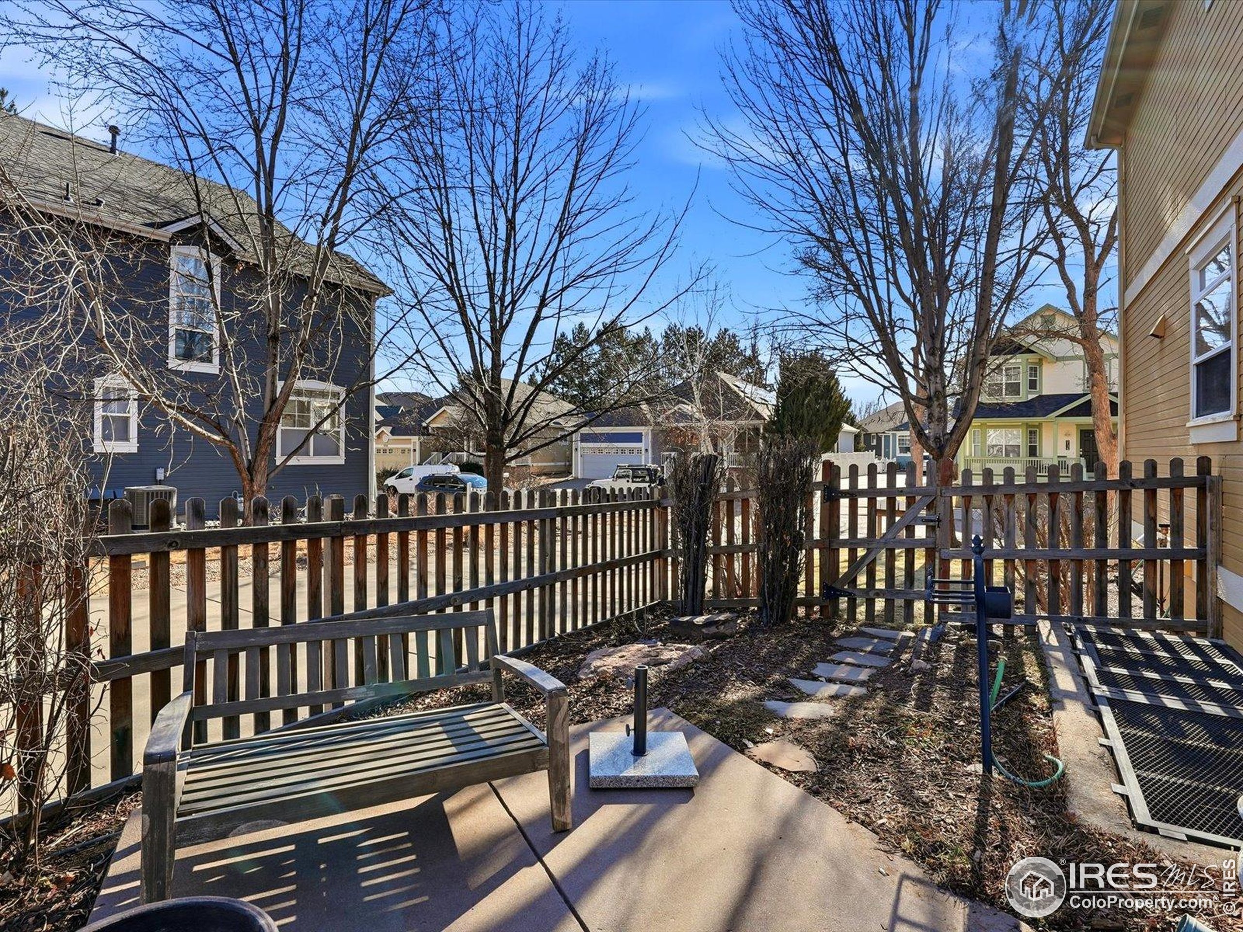 2139 Springs Place Longmont, CO 80504 - Photo 43 of 50 a view of a bench in a backyard