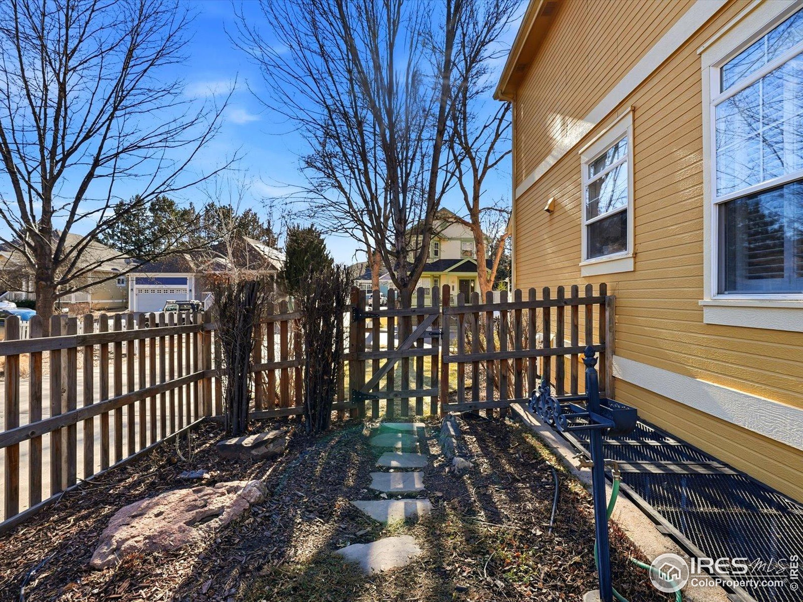 2139 Springs Place Longmont, CO 80504 - Photo 44 of 50 a view of a house with a yard