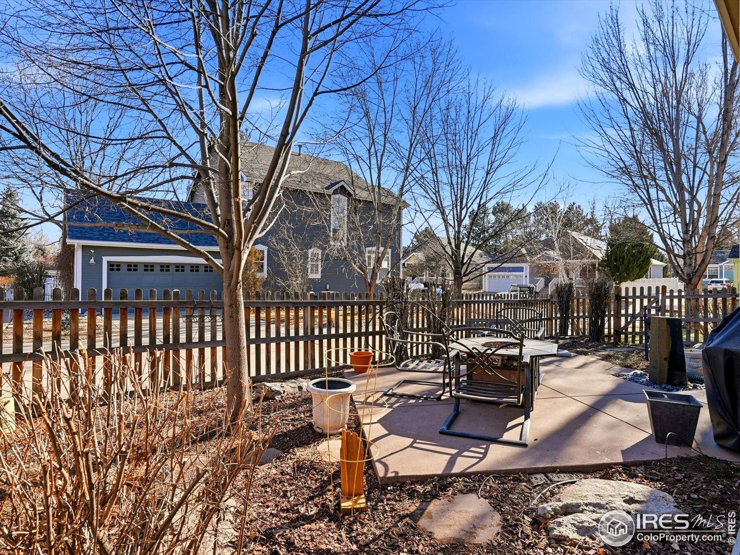 2139 Springs Place Longmont, CO 80504 - Photo 46 of 50 a view of a chairs and tables in the back yard of the house